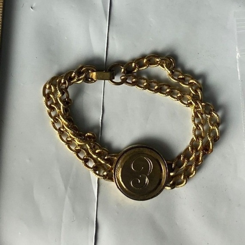 Gold Tone Chain Bracelet With Round Logo Charm